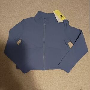 all in motion Black and Cream Clothing Label